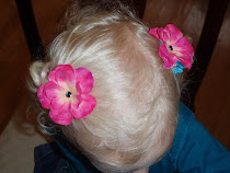 Bright pink flower hair clips with blue accent