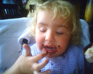 Top Ender examinging her chocolate covered fingers