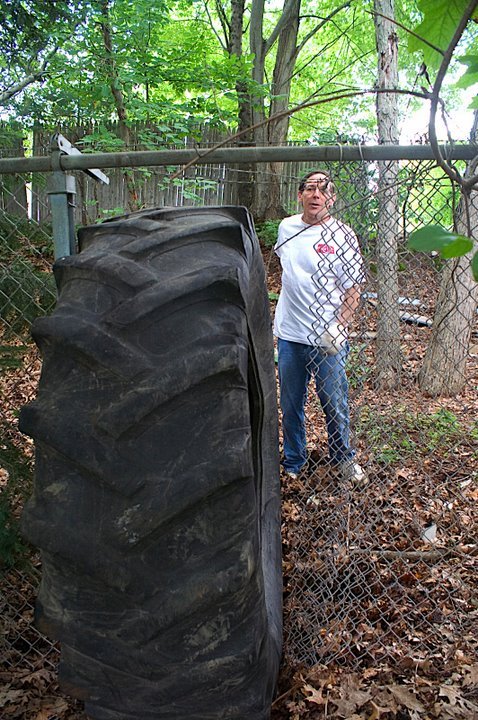 [tire+by+fence.jpg]