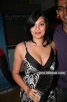 Nikhila in a daringly low neck dress sexposing mammoth cleavage