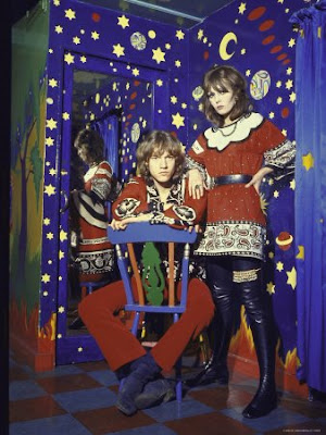 Pair of Long Haired Londoners in a Psychedelic Corner of the Beatles' Apple Boutique