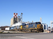 This freight train was traveling fast. I was surprised that I got my camera . (csx freight train)