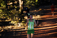 Kelsey Lewis is all smiles at the finish at the top of Red Hill