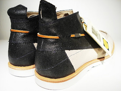 The Dory also has leather thong laces are made from American hide.