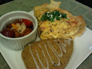 breakfast plate with scones, quiche and fruit