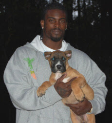 Michael Vick with puppy. We wonder where this little pooch is now?