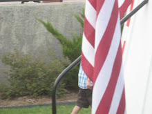 Our grandson - hidden (covered) by the U.S. flag.
