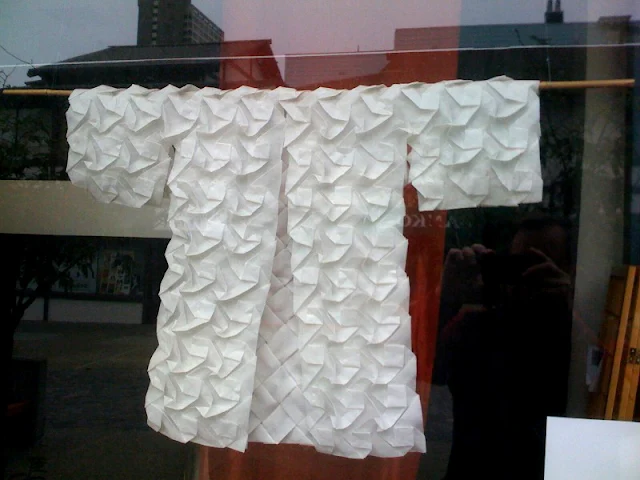 White Origami Kimono hanging in The Paper Tree store window