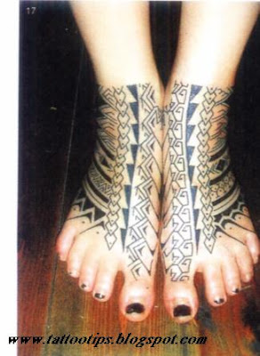 Tribal tattoos on foot of bilateral woman beside