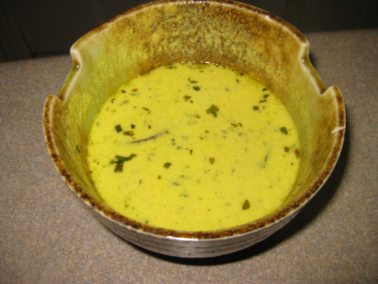 cooking Gujarati kadhi (yogurt curry)