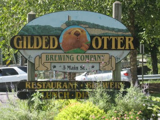 Gilded Otter sign