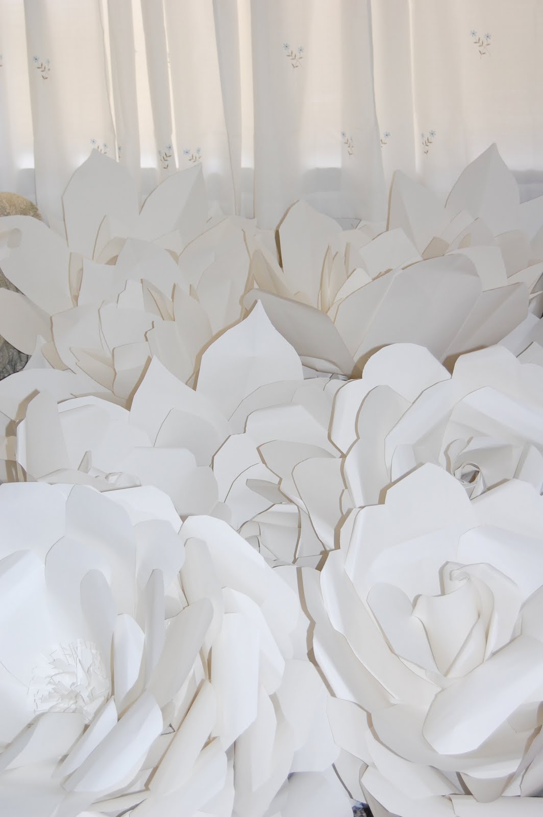 Chanel show inspired huge large white paper flowers backdrop