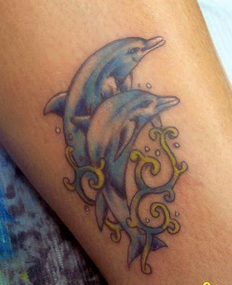 tattoos: Delphin female tattoos.