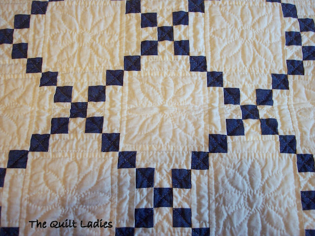 blue and white quilt in squares