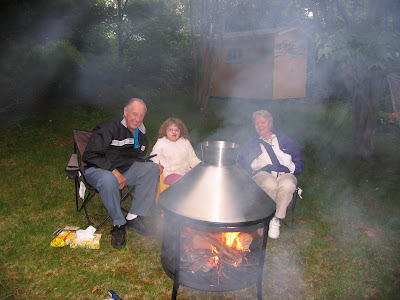 Kennedy Mom & Dad at the backyard firepit