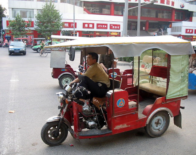 Chinese rickshaw and driver