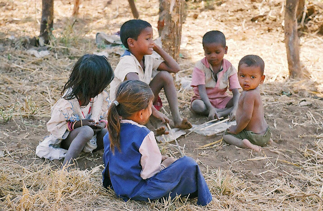 children playing with sticks in rural India