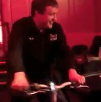 Tony G makes his entrance on a bicycle at the Big Game IV