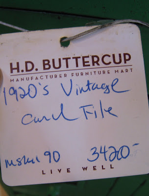 Price tag on a vintage green steel card file cabinet