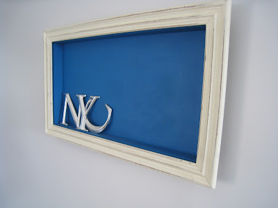 Shadow box made by Shannon Cockrell hung on a wall in her London flat