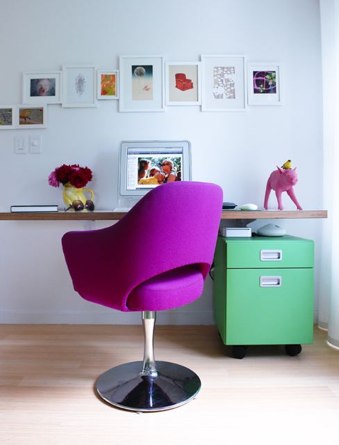 Interior designer Ghislaine Vinas' small home office with a bright purple Saarinen chair, floating desk and a green cabinet