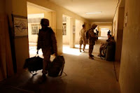 U.S. Marines move out of Joint Security Station Khadairy in the northern District of Fallujah June 18. The movement means the building is now solely an Iraqi police station.