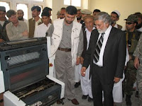 Gov. Sayeed Wahidi, the governor of Konar province, Afghanistan (dark suit), tours a new printing press facility in downtown Asad Abad. Prior to the facility opening, all print material including Asad Abad’s weekly newspaper was printed in Jalalabad, Kabul or in Pakistan.