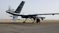 Aircrews perform a preflight check on an MQ-9 Reaper before it takes off for a mission in Afghanistan. The Reaper is larger and more heavily-armed than the MQ-1 Predator and in addition to its traditional ISR capabilities, is designed to attack time-sensitive targets with persistence and precision.