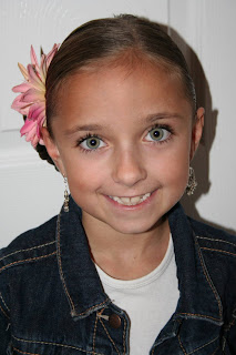Portrait of young girl modeling "Teen Hair Bun" hairstyle