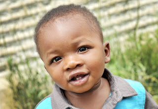 Baby boy playing outside