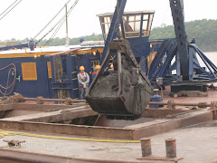 Pick the sludge out of the canal and drop it in a barge. Takes 1-1/2 hours to fill a barge.