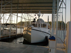 Bay Springs Marina, MS. The first time YA has had a roof over her dinghy.