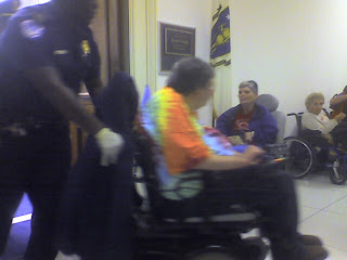 blurry picture of CDR's board president Gene Spinning being arrested