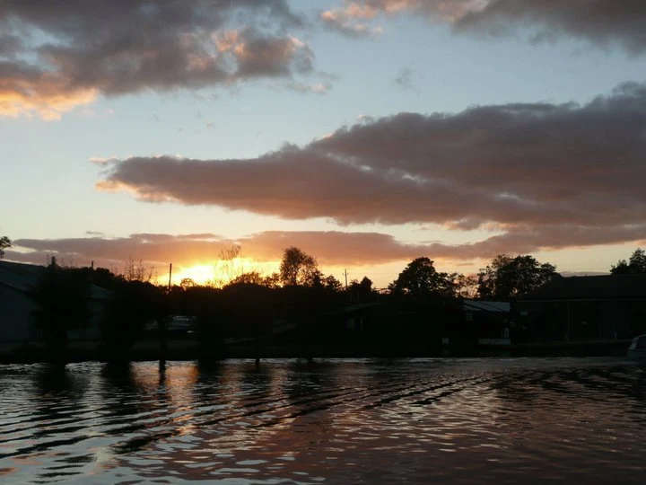 An end to a perfect day as the sun sets over the River Bure at Wroxham