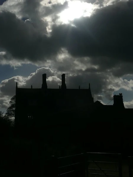 On the left, deep shades of blue in the River Bure at Wroxham, on the right the ghostly looking Little Hautbois Hall