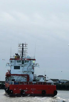 On the left, the footpath succombs to coastal erosion at Corton. On the right, a ship heads out to sea at Gorleston