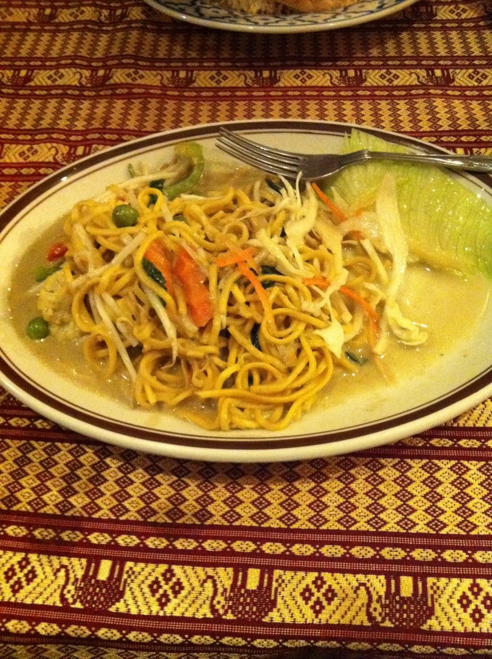 What I Eat Thai egg noodles with vegetables and green curry followed by a Singhai beer.