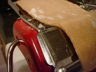 running cannoli dough through pasta machine