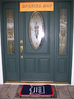 Makl front door with Opening Day sign above door and Tigers Welcome Mat on the porch