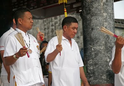 Men with incense at Kathu Shrine