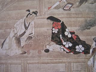 Un jeune garçon et une jeune fille jouant au go. Rouleau vertical datant du XVIIe siècle.