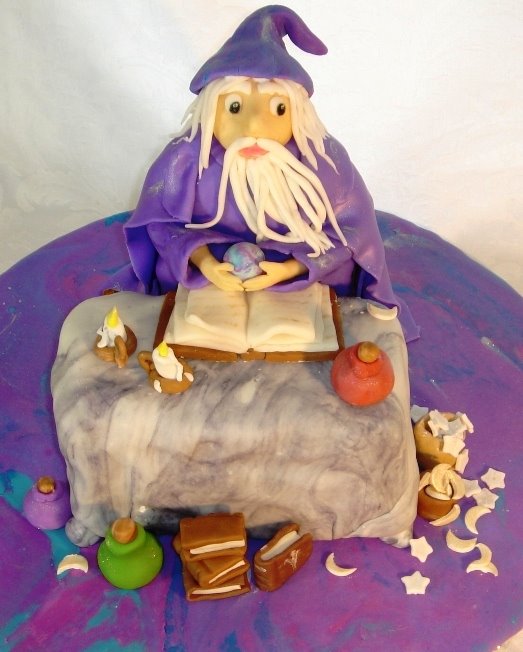 [Wizard+cake+with+sugar+sculpture+books,+candles,jars,+moons+and+stars.jpg]