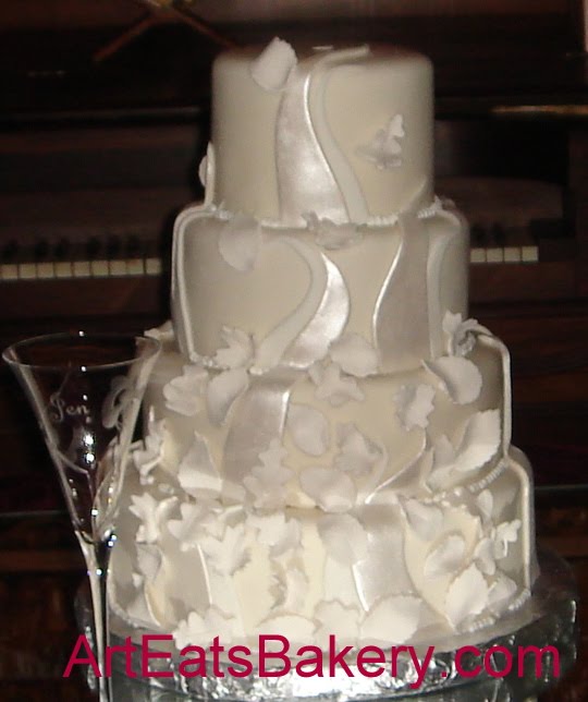 [Four+tier+round+fondant+wedding+cake+with+sugar+leaves.jpg]