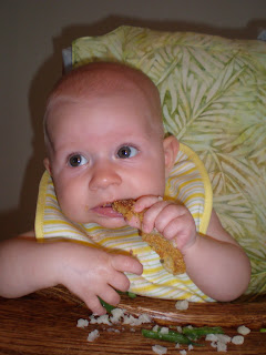 Baby eating fish
