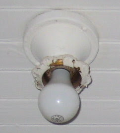 Overhead light in hall bath