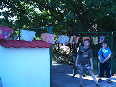 Two boys at a house in Bulgaria with flags