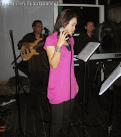 singer Nas Adila singing with the live band