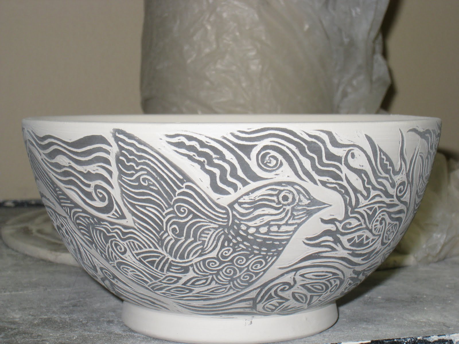 Randi Martin Kish/Ceramics Carving designs into cups using underglazes...