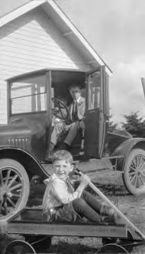 Boy with Sherwood Spring coaster wagon 1920