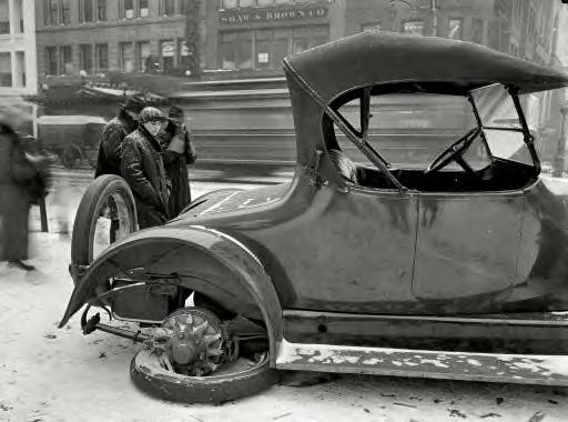Washington, D.C., 1917. Dr. W.J. Davis with a flat tire in winter